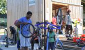 People fixing bikes at New Columbia - 